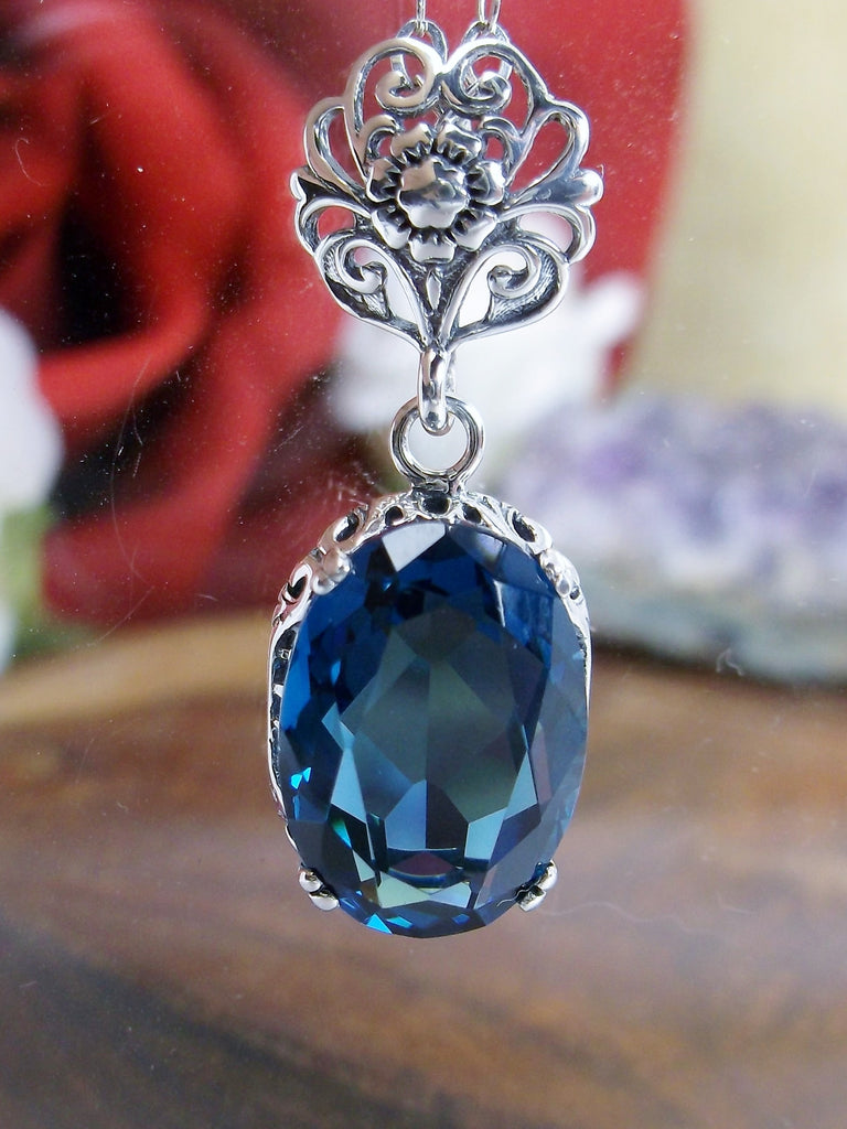 London Blue Topaz Pendant Necklace, london blue pendant, with a vibrant blue oval stone set in floral sterling silver filigree, 4 prongs hold the gem in place, Silver Embrace Jewelry