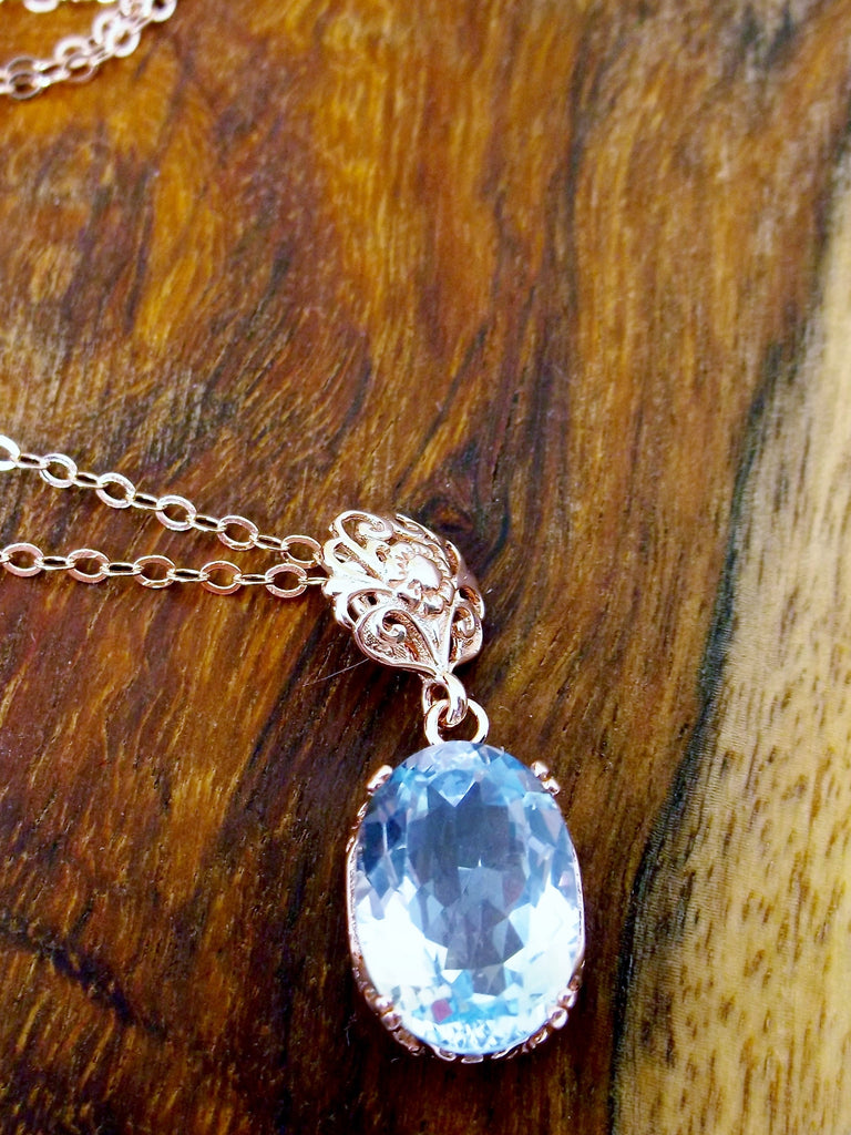 Natural Topaz Pendant Necklace, blue topaz pendant, with a natural blue topaz oval stone set in floral rose gold filigree, 4 prongs hold the gem in place, Silver Embrace Jewelry
