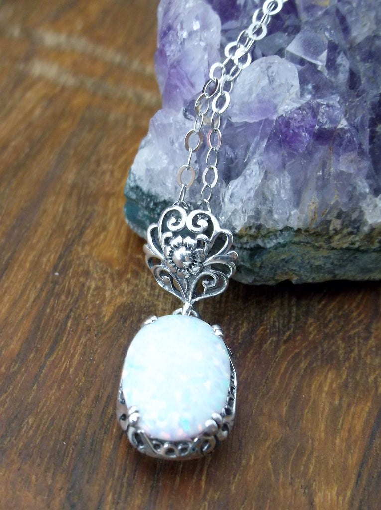 Opal pendant necklace, with a rainbow white opal oval stone set in floral sterling silver filigree, 4 prongs hold the gem in place, Silver Embrace Jewelry