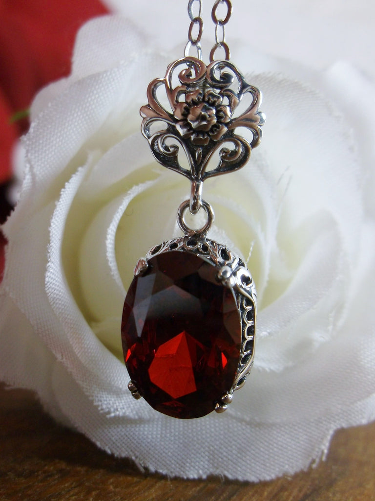 Red Garnet CZ Pendant Necklace, garnet pendant, with a deep red oval stone set in floral sterling silver filigree, 4 prongs hold the gem in place, Silver Embrace Jewelry