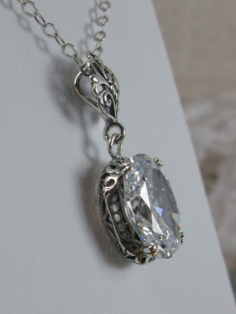 White Cubic Zirconia pendant necklace, with a brilliant clear oval stone set in floral sterling silver filigree, 4 prongs hold the gem in place, Silver Embrace Jewelry