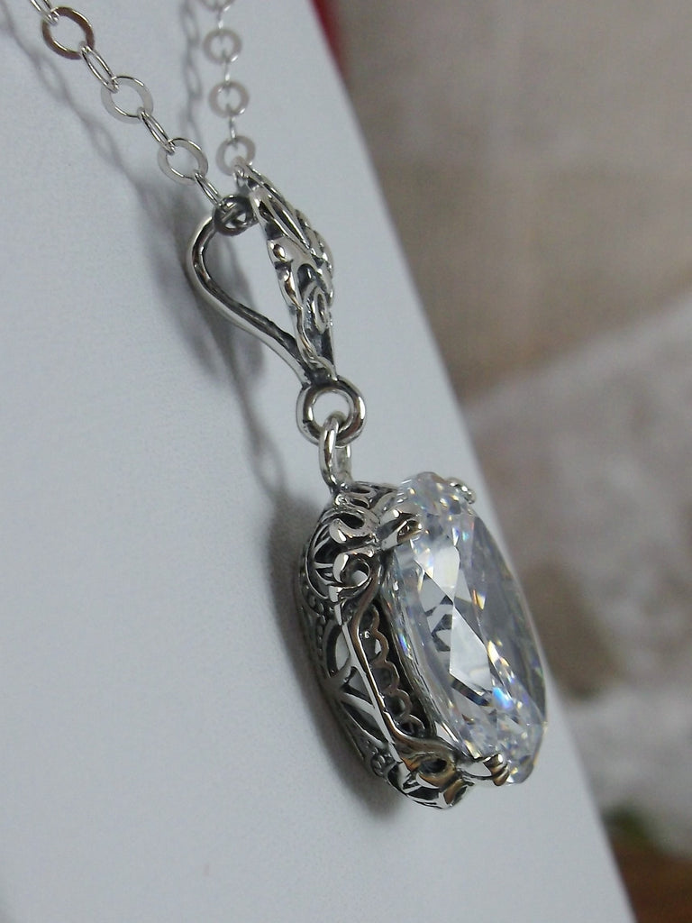 White Cubic Zirconia pendant necklace, with a brilliant clear oval stone set in floral sterling silver filigree, 4 prongs hold the gem in place, Silver Embrace Jewelry