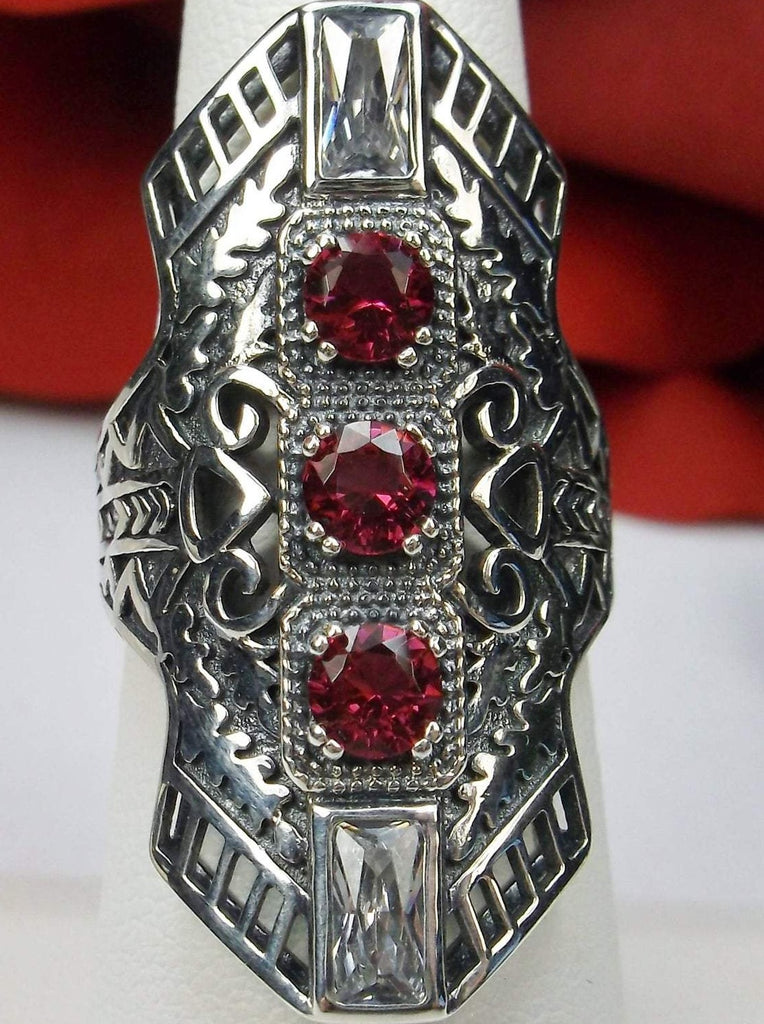 Ruby Red Art Deco Ring, with three round stones and two baguette stones, intricate 1930s filigree adorns the ring and the band