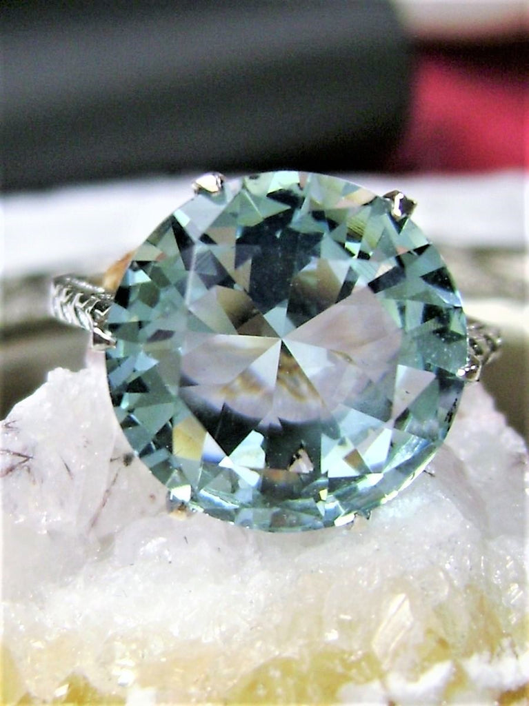 a ring with a blue topaz surrounded by crystals