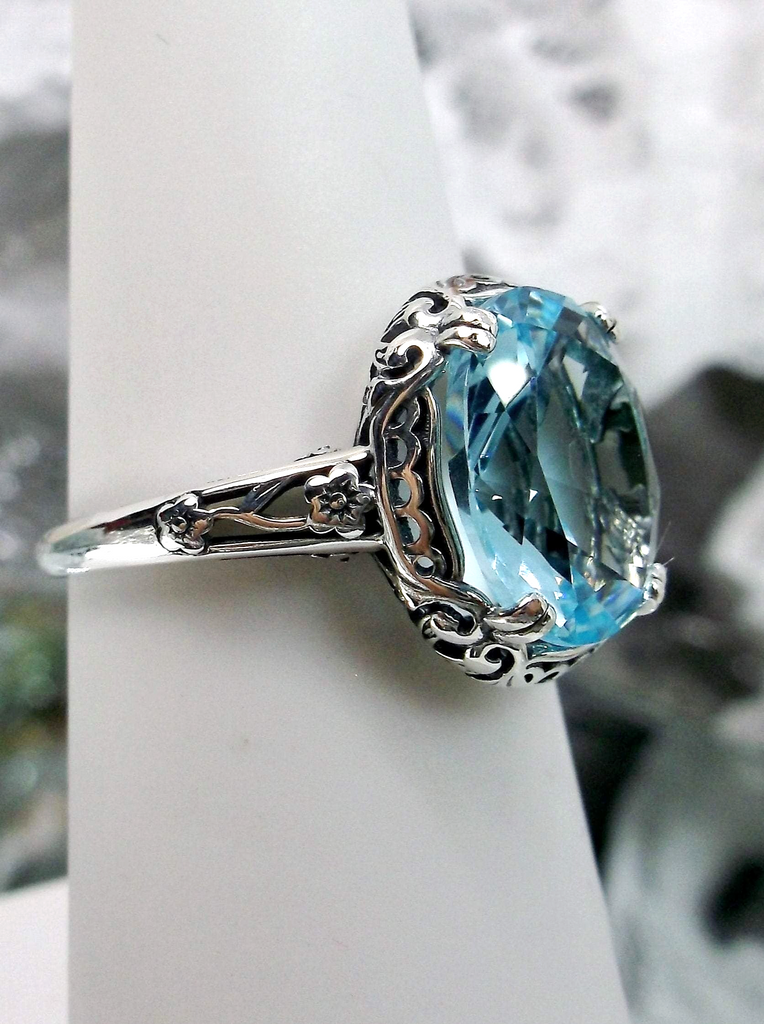Aquamarine Ring, Sky Blue simulated oval gemstone, Sterling Silver floral filigree, Edward design #D70z,  offset side view