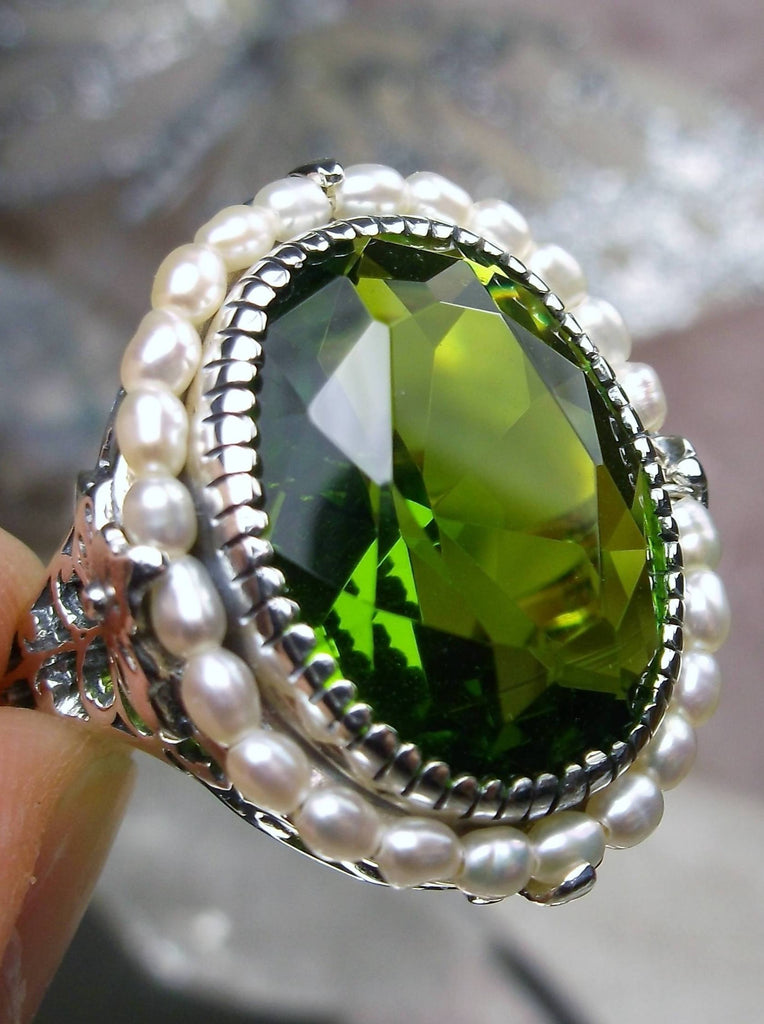 Peridot Ring, Seed Pearls surround and accent the simulated oval stone with sterling silver Victorian filigree