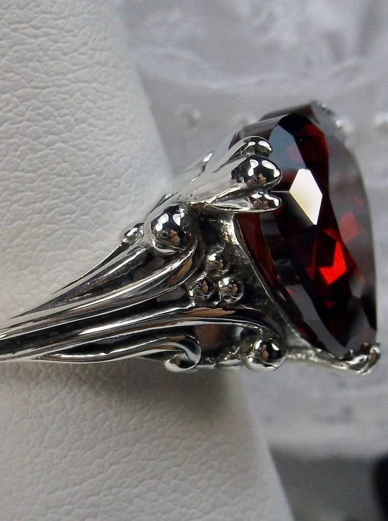 red garnet cubic zirconia ring with a heart shaped gem and gothic style sterling silver filigree