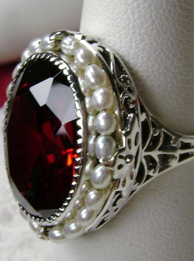 Garnet Ring, Seed Pearls surround and accent the simulated oval stone with sterling silver Victorian filigree