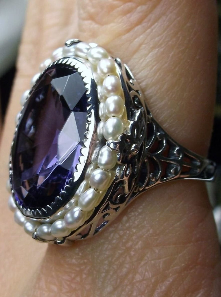 Amethyst Ring, Seed Pearls surround and accent the simulated oval stone with sterling silver  Victorian filigree