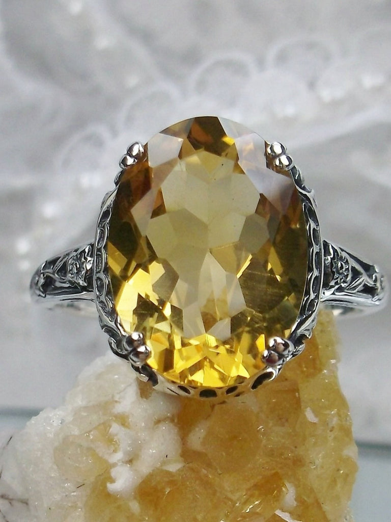 Natural Citrine Ring, Oval yellow citrine gemstone, sterling silver floral filigree, Edward Design #D70, front view on a yellow crystal stone