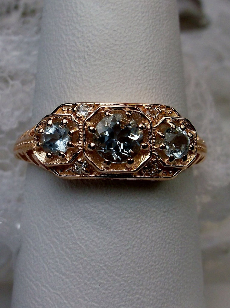 Art deco style ring with three sky blue topaz set in 14k Gold filigree