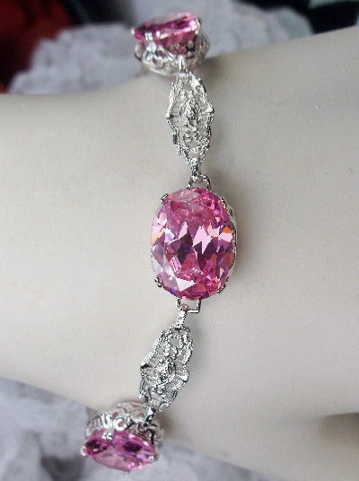 Rhodium plated sterling silver bracelet with pink CZ oval gemstones and Edwardian detailed filigree