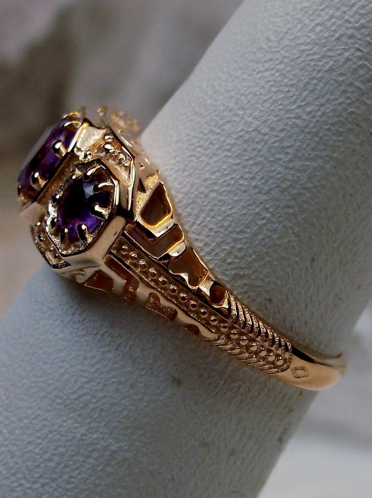 Art deco style ring with three Purple amethysts set in rose gold filigree
