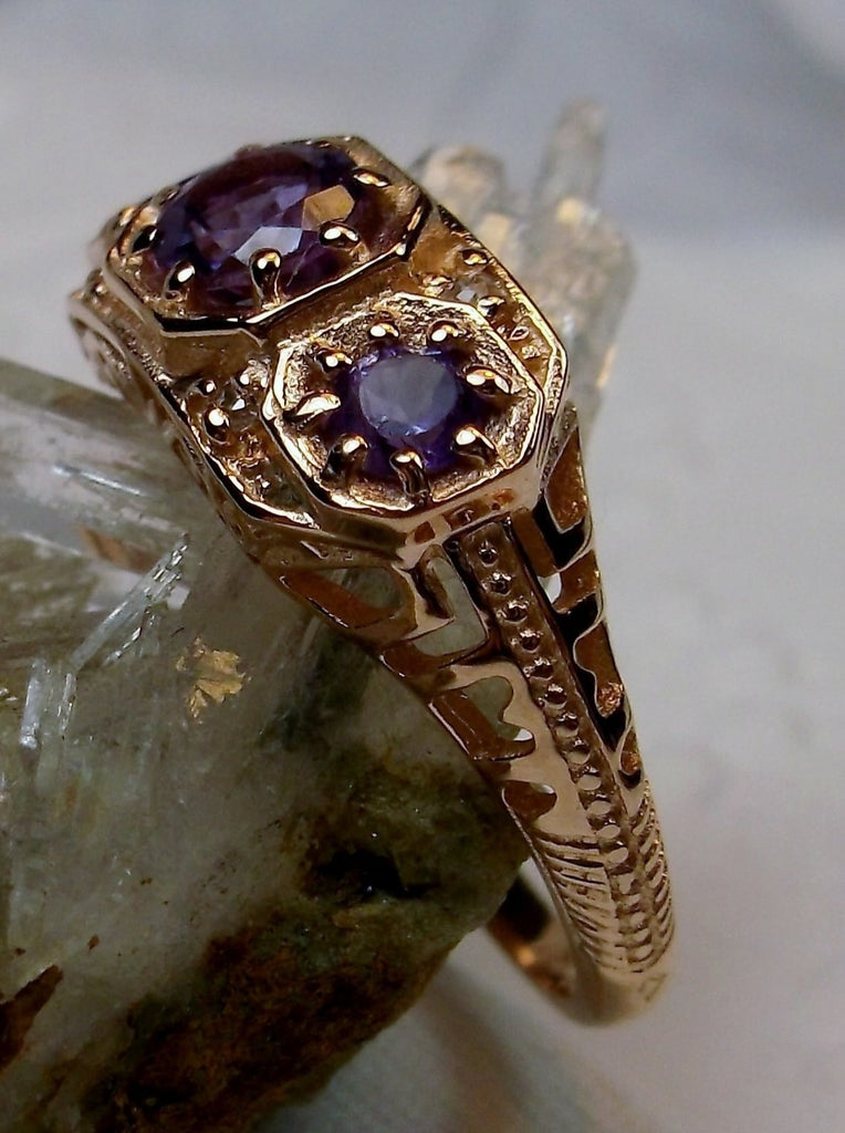 Art deco style ring with three Purple amethysts set in rose gold filigree