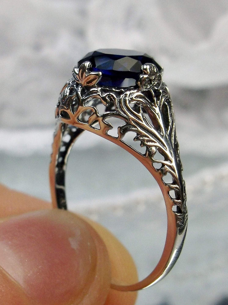 blue sapphire solitaire ring with swirl antique floral sterling silver filigree