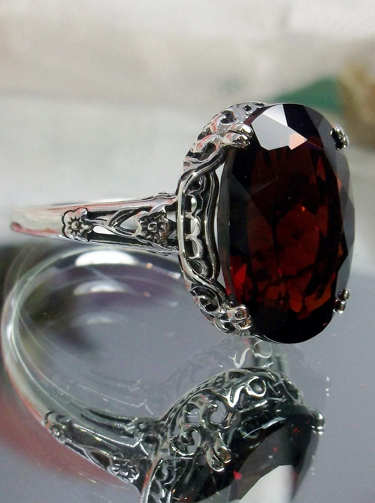 Natural Garnet Ring,  6.9 carat oval faceted natural gemstone, Sterling Silver floral filigree, Edward design #D70,  side view on mirror