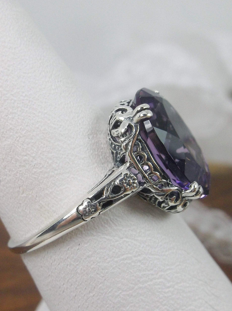 Side view of a Natural Purple Amethyst Sterling Silver Filigree Ring, Edward Design#70 on a ring holder