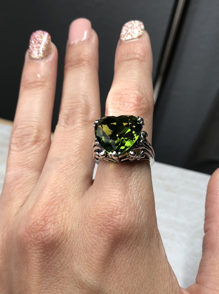 Green Peridot ring with a heart shaped gem and gothic style sterling silver filigree