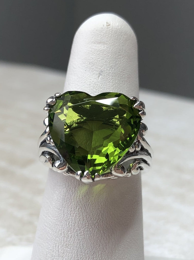 Green Peridot ring with a heart shaped gem and gothic style sterling silver filigree