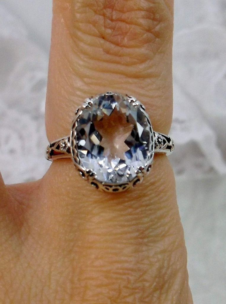 Natural White Topaz Ring, 5 carat oval faceted gemstone,  Sterling Silver Floral Filigree, Edward design #D70z, top view on ring finger
