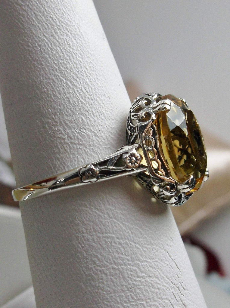 Natural Citrine Ring, Oval yellow citrine gemstone, sterling silver floral filigree, Edward Design #D70z, side view on ring holder