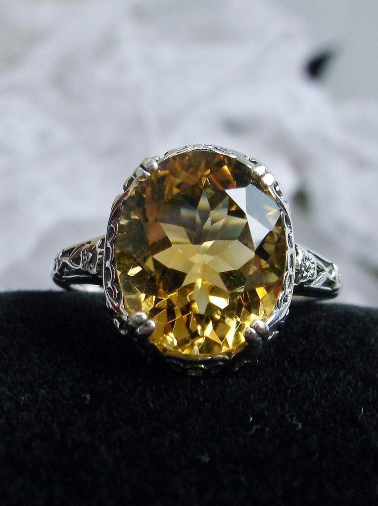 Natural Citrine Ring, Oval yellow citrine gemstone, sterling silver floral filigree, Edward Design #D70z, top view on black velvet