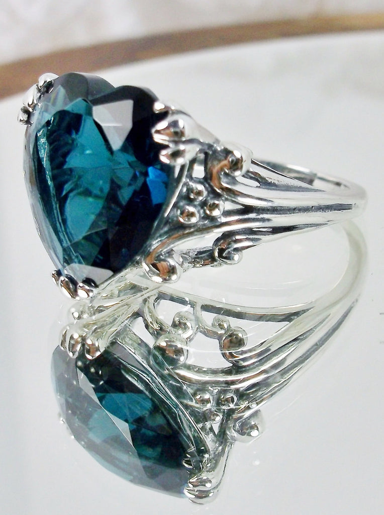 London Blue Topaz ring with a heart shaped gem and gothic style sterling silver filigree