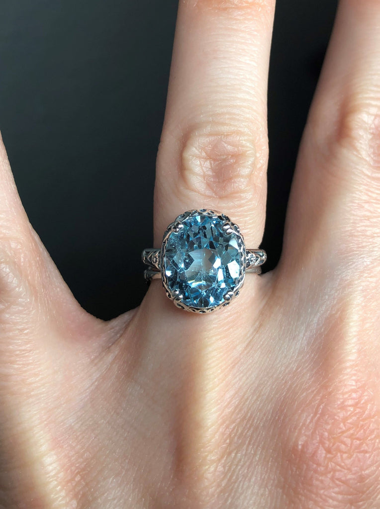 Natural Sky Blue Topaz Ring, 4.5 carat oval faceted stone, sterling Silver floral filigree, Edward design #D70z, top view on hand
