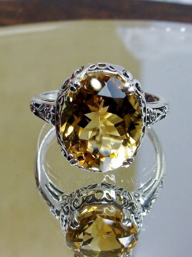 Natural Citrine Ring, Oval yellow citrine gemstone, sterling silver floral filigree, Edward Design #D70z, front view on a mirror