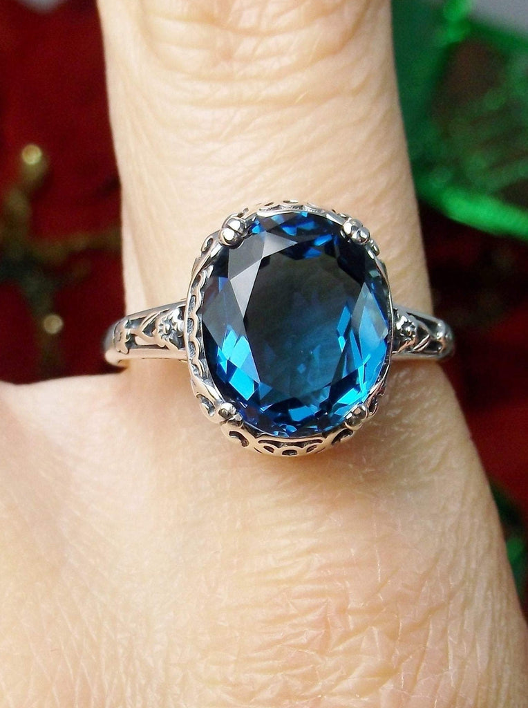 London Blue Topaz Ring, oval simulated topaz, sterling silver floral filigree, Edward design #70z, top view on finger