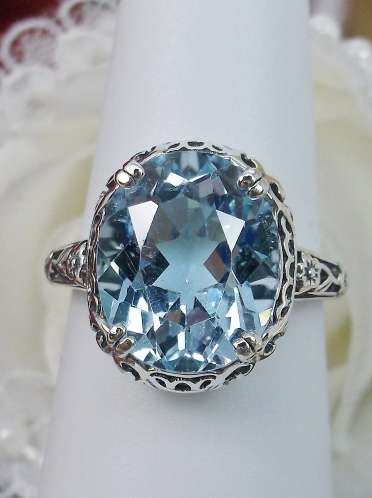 Natural Sky Blue Topaz Ring, 4.5 carat oval faceted stone, sterling Silver floral filigree, Edward design #D70z, top view on ring form