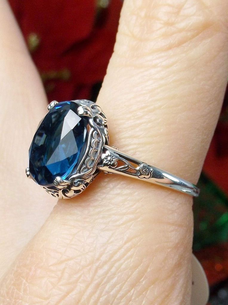 London Blue Topaz Ring, oval simulated topaz, sterling silver floral filigree, Edward design #70z, side view on finger