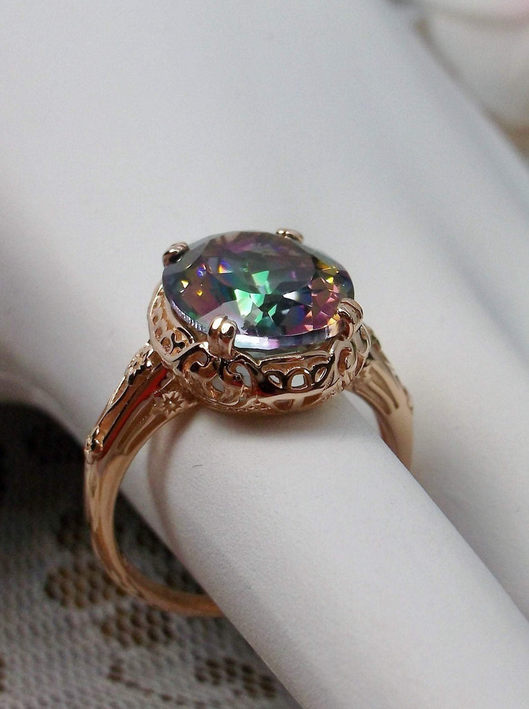 Natural Mystic Topaz Ring,  Oval Faceted natural gemstone, Rose Gold over Sterling Silver floral filigree, Edward design #D70z, offset side  view of setting and band on hand form