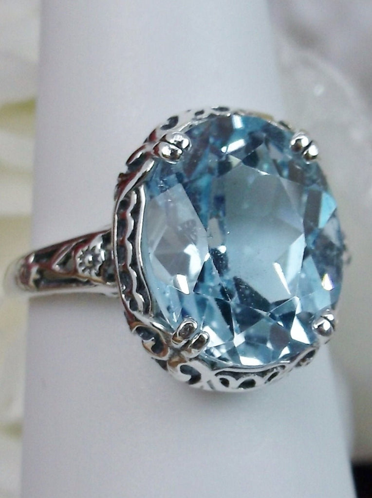 Natural Sky Blue Topaz Ring, 4.5 carat oval faceted stone, sterling Silver floral filigree, Edward design #D70z, offset view on ring form
