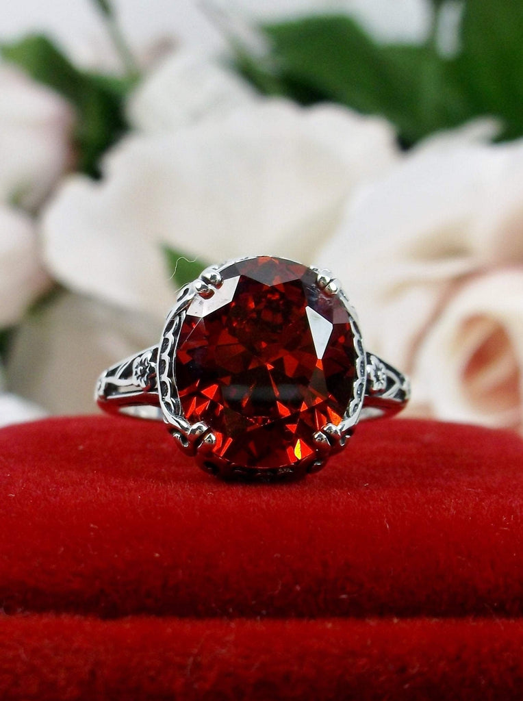 Red Garnet CZ Ring, Sterling Silver floral filigree, Edward Design #D70z, front view on red velvet