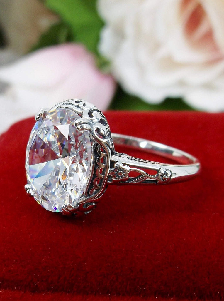 White CZ Ring, cubic zirconia gemstone, Sterling Silver floral Filigree, Edward design #D70z, offset side view on red velvet surface