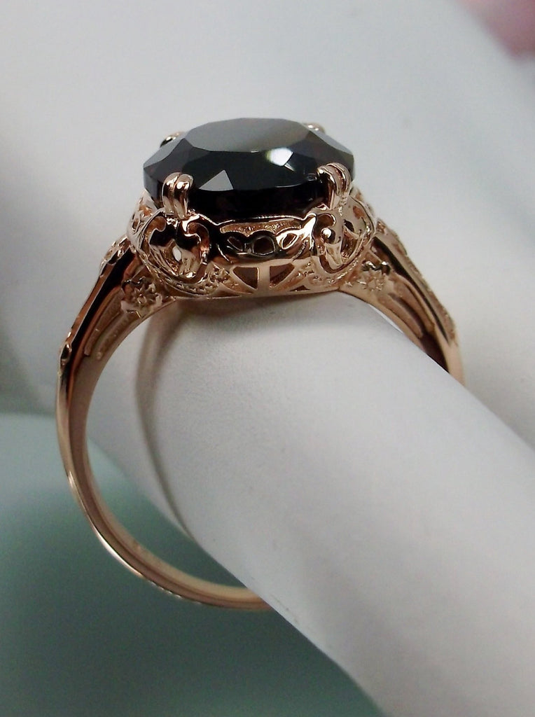 Natural Garnet Ring, Rose Gold over Sterling Silver, floral filigree setting and band, oval garnet stone, Edward design#70z, side view of the setting and gem on a hand form