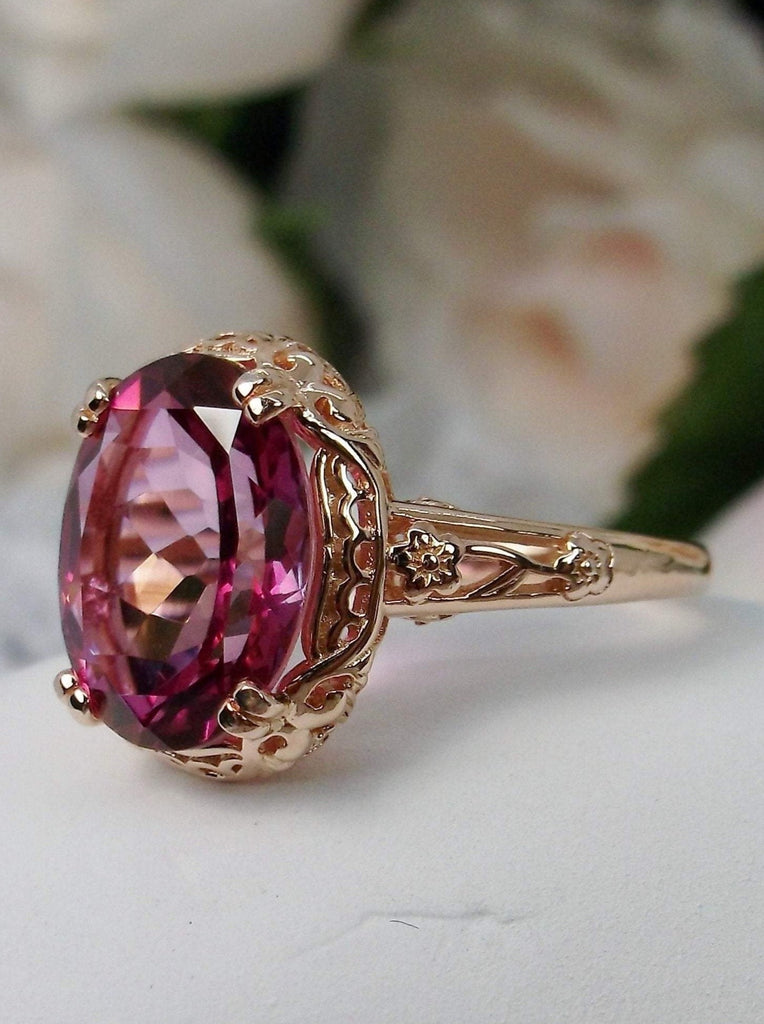 Natural Pink Topaz Ring, 3.4 carat oval faceted gemstone, Rose Gold Plated Sterling Silver floral filigree, Edwardian Design#D70z, Side view on white cloth surface