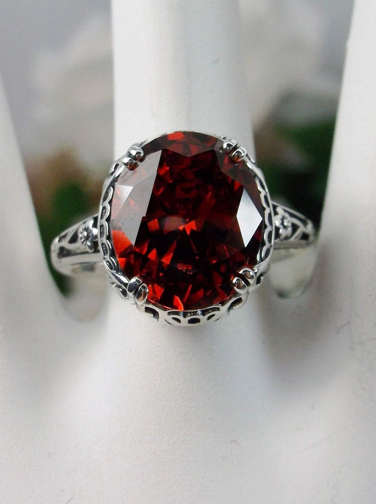 Red Garnet CZ Ring, Sterling Silver floral filigree, Edward Design #D70z, front view on ring holder