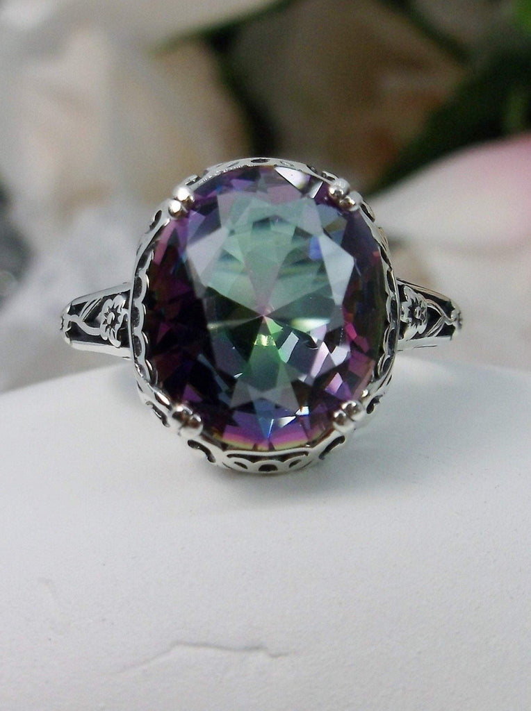Mystic topaz ring, simulated Rainbow Topaz, Sterling Silver floral Filigree, Edward design#D70z, top view on white cloth surface