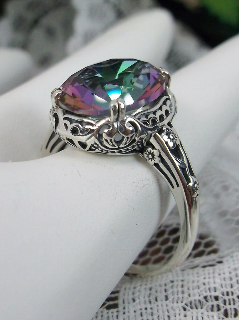 Mystic topaz ring, simulated Rainbow Topaz, Sterling Silver floral Filigree, Edward design#D70z, off set side view on hand form