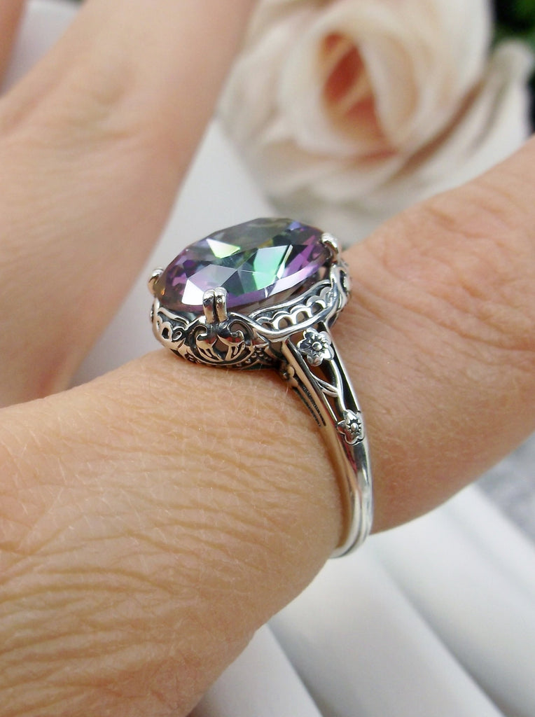 Mystic topaz ring, simulated Rainbow Topaz, Sterling Silver floral Filigree, Edward design#D70z,  offset side view on a finger