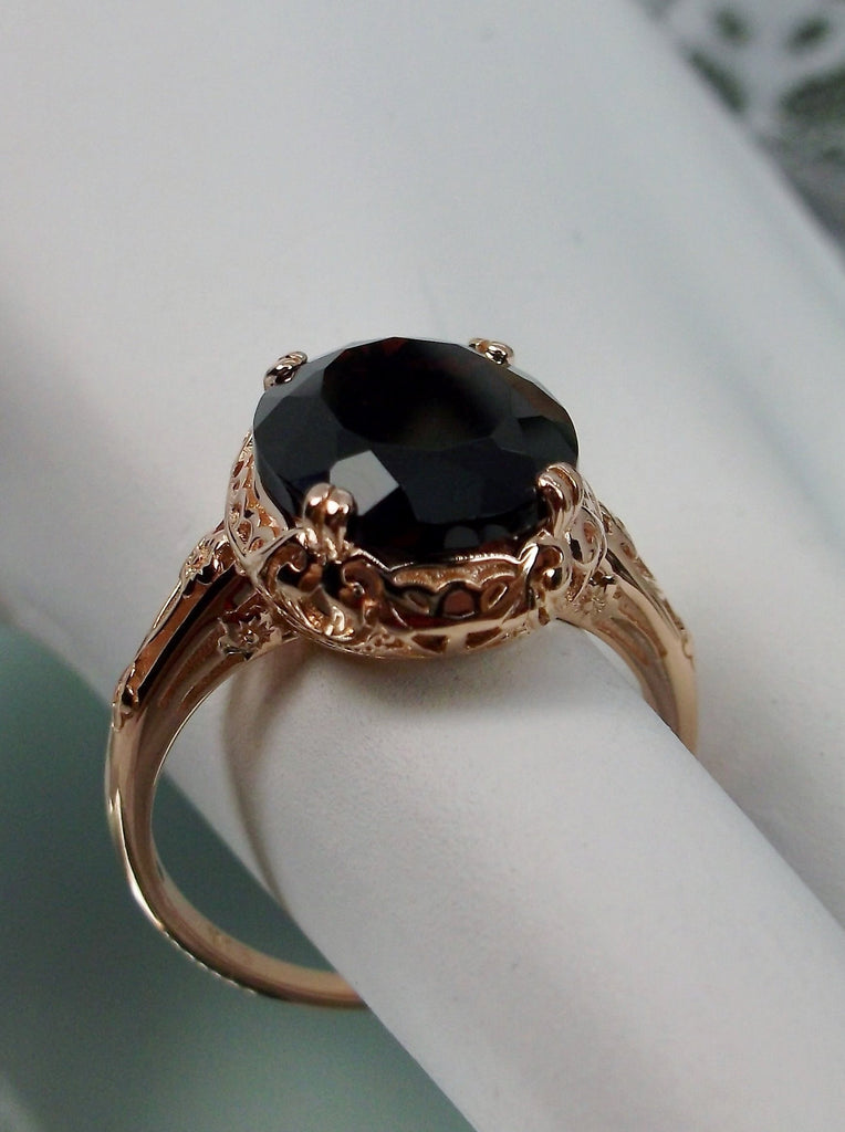 Natural Garnet Ring, Rose Gold over Sterling Silver, floral filigree setting and band, oval garnet stone, Edward design#70z, offset top and front view on a hand form