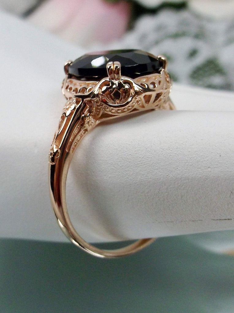 Natural Garnet Ring, Rose Gold over Sterling Silver, floral filigree setting and band, oval garnet stone, Edward design#70z, side view on a hand form