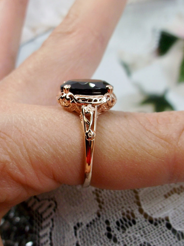 Natural Garnet Ring, Rose Gold over Sterling Silver, floral filigree setting and band, oval garnet stone, Edward design#70z, side view on a finger